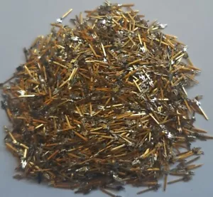 A close-up view of high-quality non-magnetic gold-plated electronic pins, 20 grams, ideal for gold recovery.