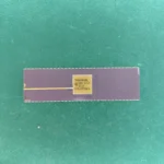 TMS9900JDL ceramic CPU with gold top and ruler for size reference