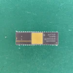 Texas Instruments SNJ55501EJD gold-top ceramic IC on green background