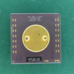 DEC Alpha 21064-BB A233 ceramic CPU with large gold heat spreader on green background