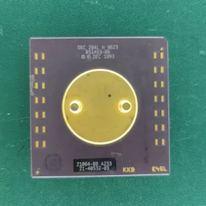 DEC Alpha 21064-BB A233 ceramic CPU with large gold heat spreader on green background