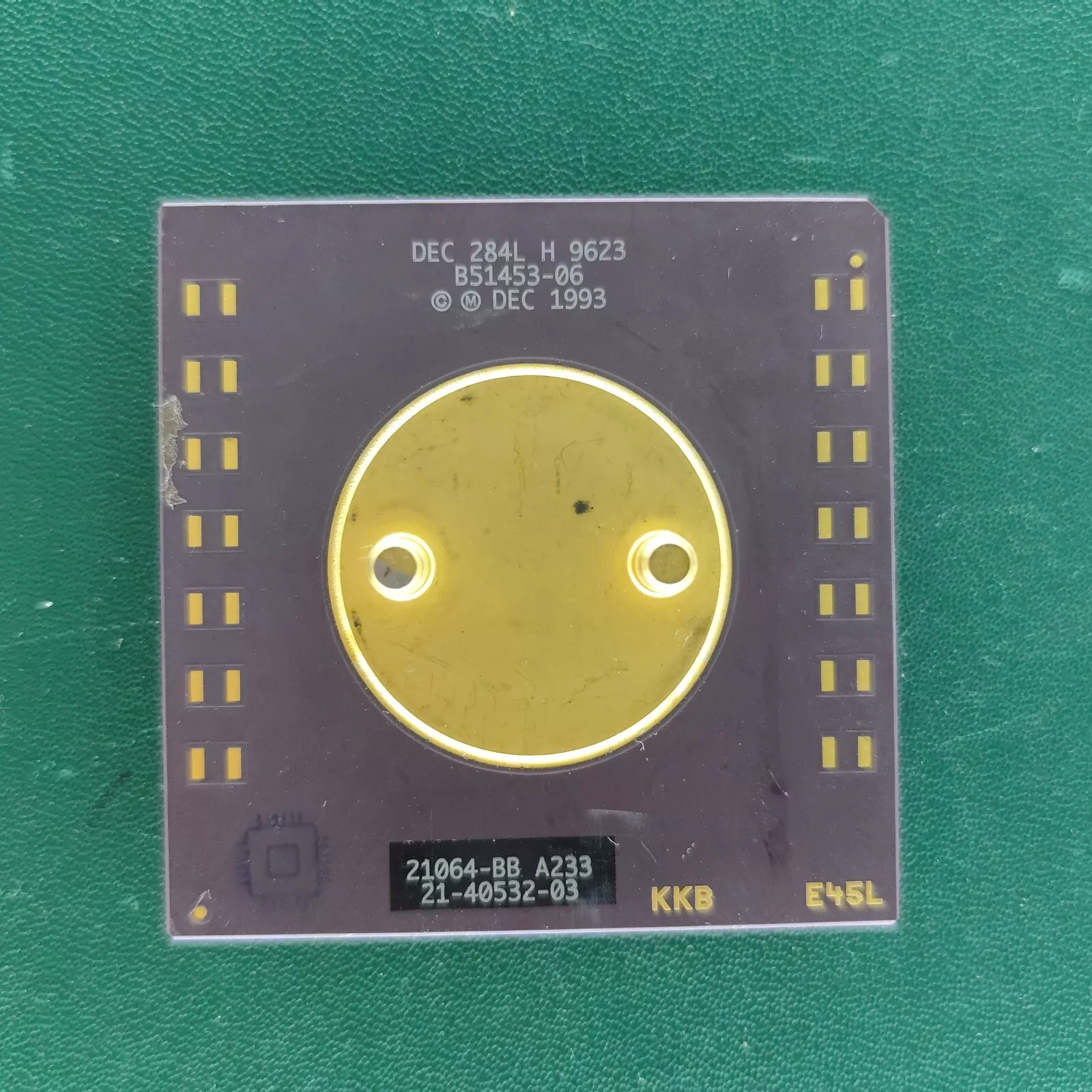 image_2 DEC Alpha 21064-BB A233 ceramic CPU with large gold heat spreader on green background