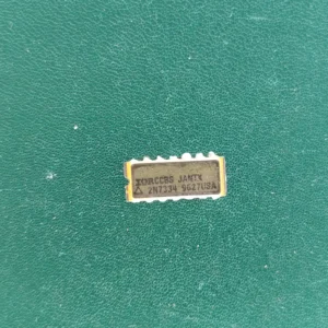 2N7334 JANTX ceramic IC with gold pins on green background