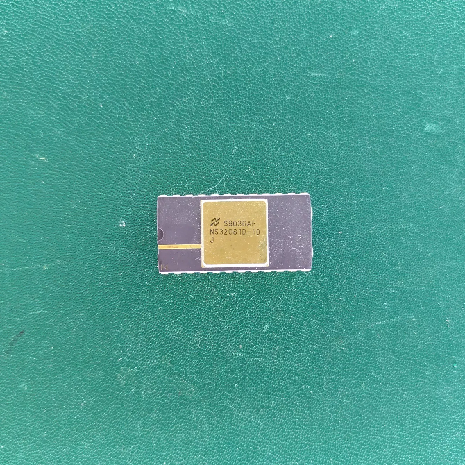 image_3 National Semiconductor NS32081D-10J ceramic FPU with gold top on green background