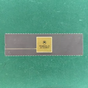 Motorola MC68000L10 long ceramic CPU with gold top and gold pins on green background