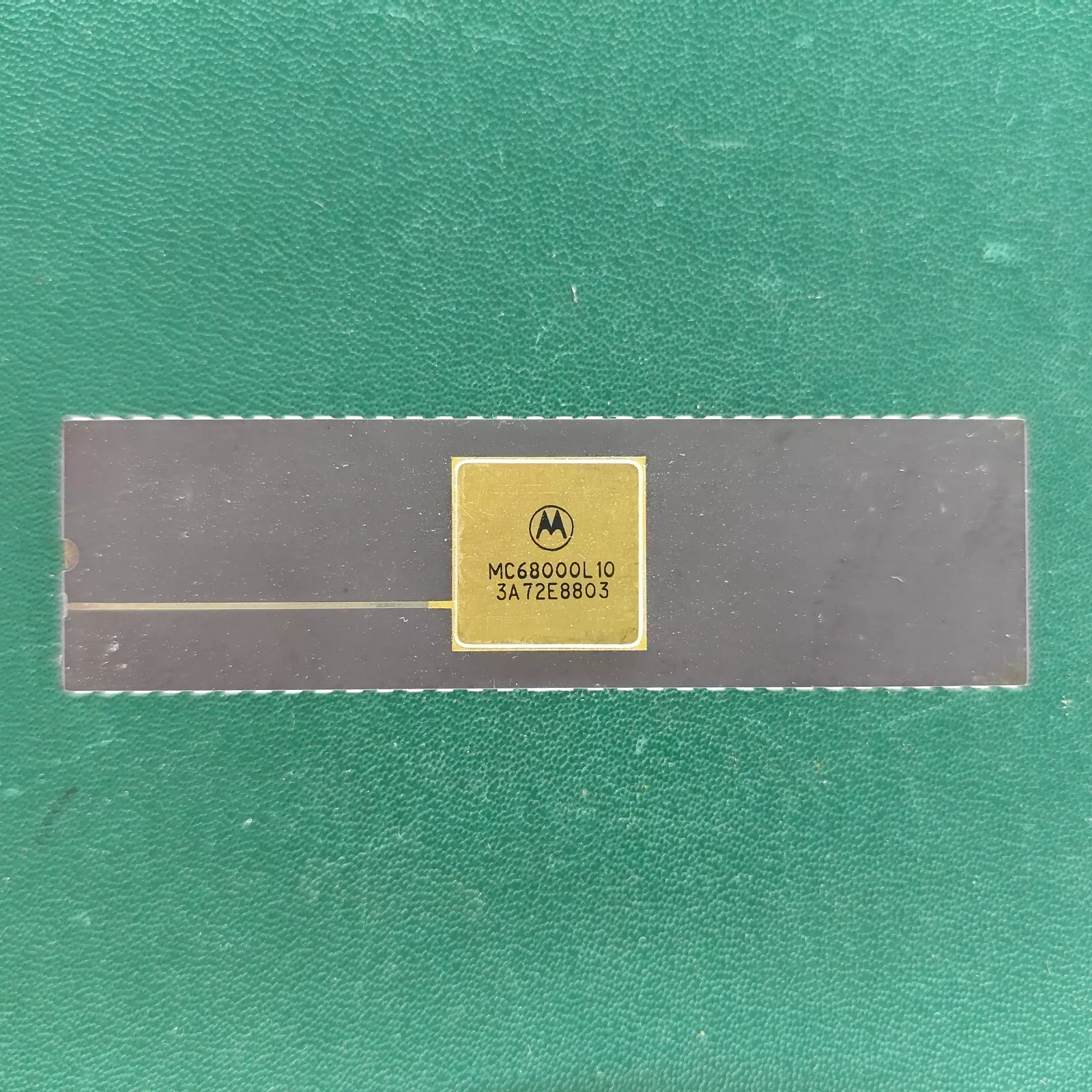 image_3 Motorola MC68000L10 long ceramic CPU with gold top and gold pins on green background