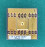 Close-up photo of HP 1FZ6-0005 ceramic hybrid module with gold top on green background.