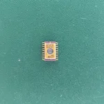 ST62E10 gold ceramic IC on green background