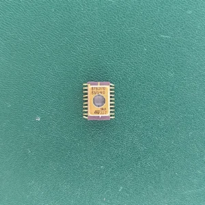 ST62E10 gold ceramic IC on green background