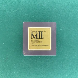 Cyrix MII-v 300GP ceramic CPU with gold top on green background