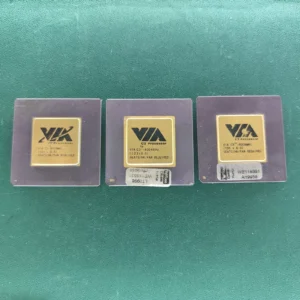 Three VIA C3 800MHz ceramic CPUs with gold tops on green background