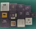 Lot of 13 mixed vintage CPUs including Intel, AMD, VIA and ceramic gold-top processors on green background