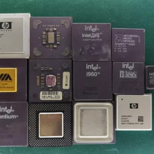 Lot of 13 mixed vintage CPUs including Intel, AMD, VIA and ceramic gold-top processors on green background