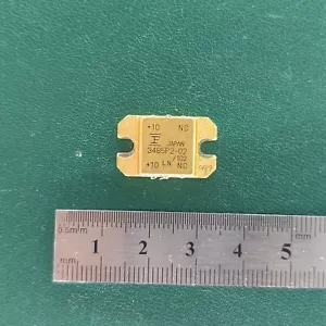 Gold ceramic RF power transistor 3485P2-02 from Japan with ruler for scale